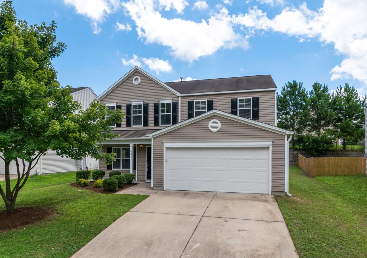 Two-story home exterior with clean siding