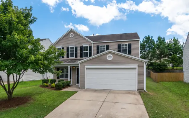 Two-story home exterior with clean siding