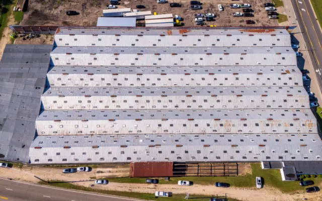Aerial view of a large commercial warehouse roof